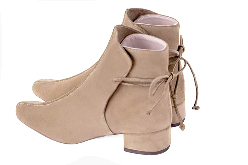 Tan beige women's ankle boots with laces at the back. Round toe. Low block heels. Rear view - Florence KOOIJMAN